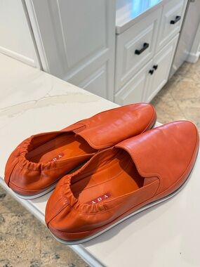 Orange Prada Loafers